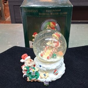 Santa And Elf Making Toys For Christmas